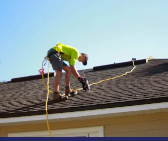 Person on a roof to repair it
