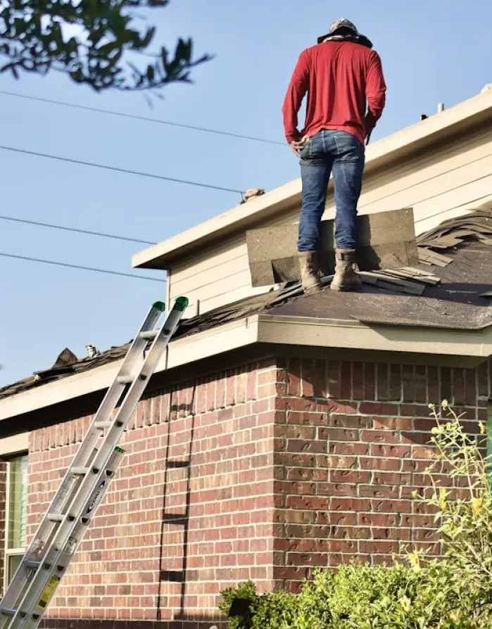 Man inspecting a roof